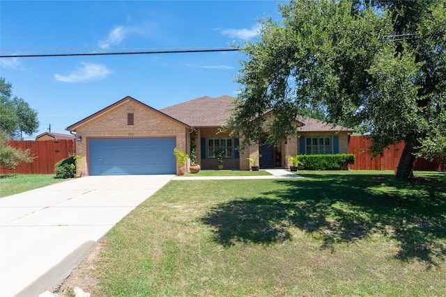 ranch-style house with a front lawn and a garage