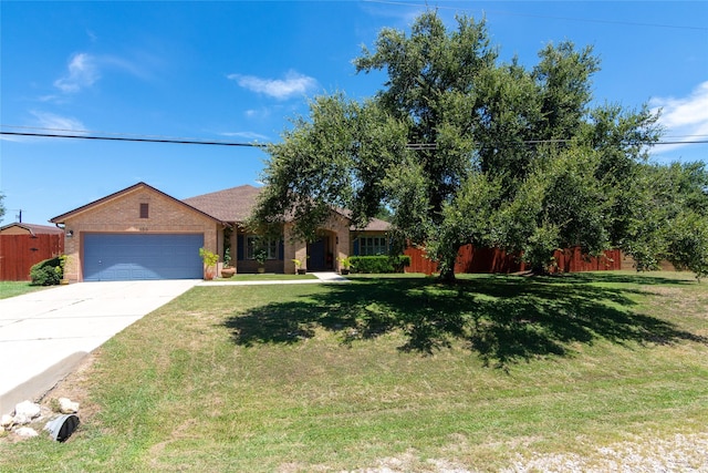 ranch-style home featuring a front lawn and a garage