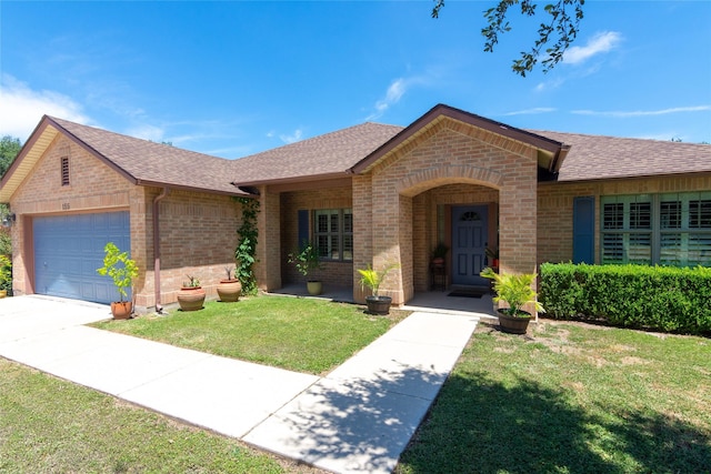 single story home featuring a front yard and a garage