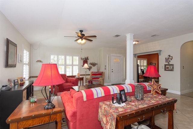 tiled living room featuring decorative columns and ceiling fan