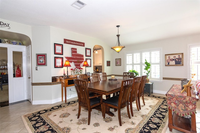 dining area with light tile patterned floors