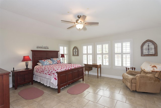 bedroom with ceiling fan and light tile patterned floors