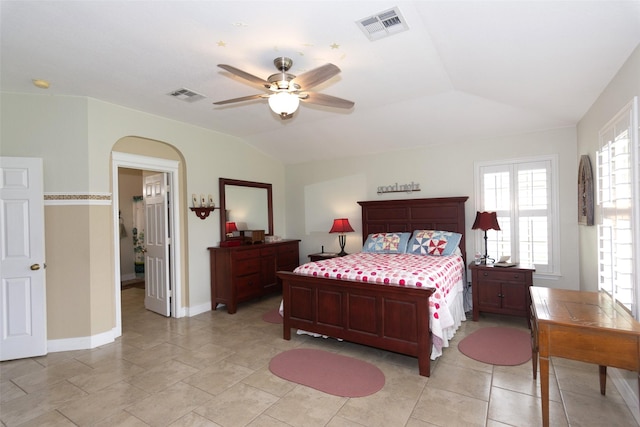 tiled bedroom with vaulted ceiling and ceiling fan