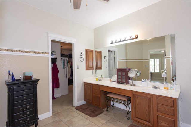 bathroom with ceiling fan, tile patterned flooring, and vanity