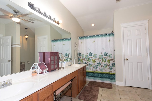 bathroom featuring vaulted ceiling, tile patterned flooring, shower / bath combination with curtain, ceiling fan, and vanity