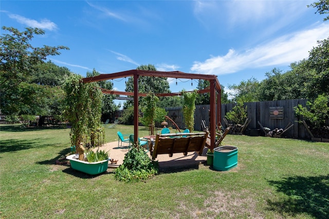 view of playground featuring a patio area and a lawn