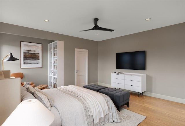 bedroom with ceiling fan and light wood-type flooring