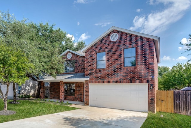 front of property with a front lawn and a garage