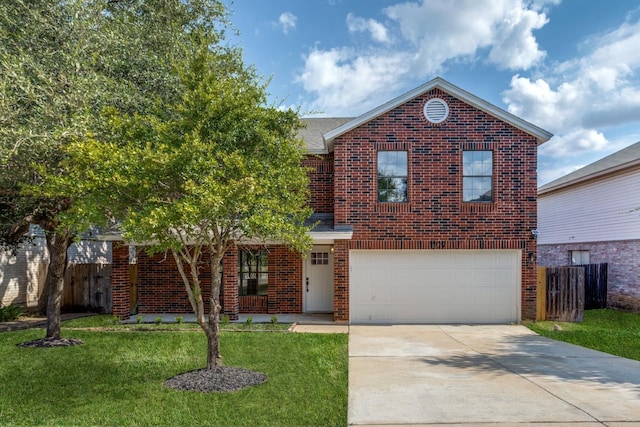 view of property featuring a front lawn and a garage