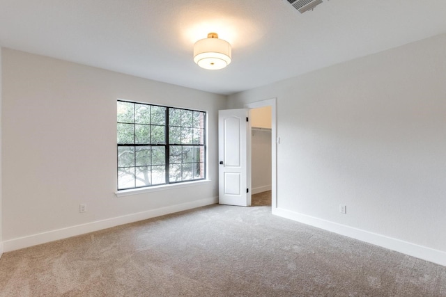 spare room featuring carpet floors