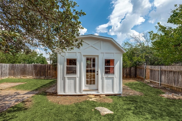 view of outbuilding with a lawn