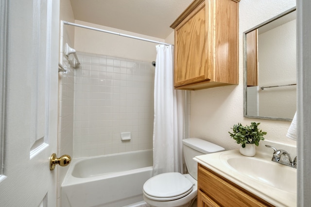 full bathroom featuring toilet, shower / bath combination with curtain, and vanity