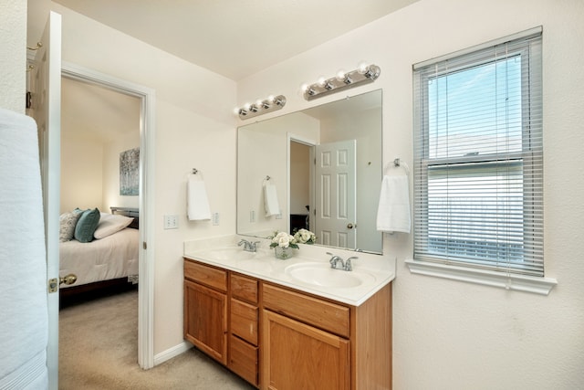 bathroom with vanity and plenty of natural light