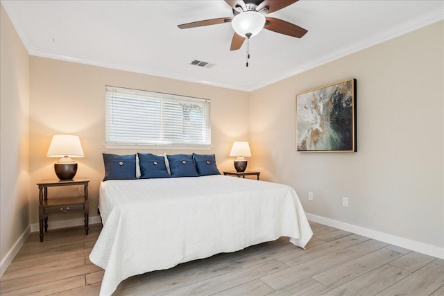 bedroom with ceiling fan, crown molding, and light hardwood / wood-style floors