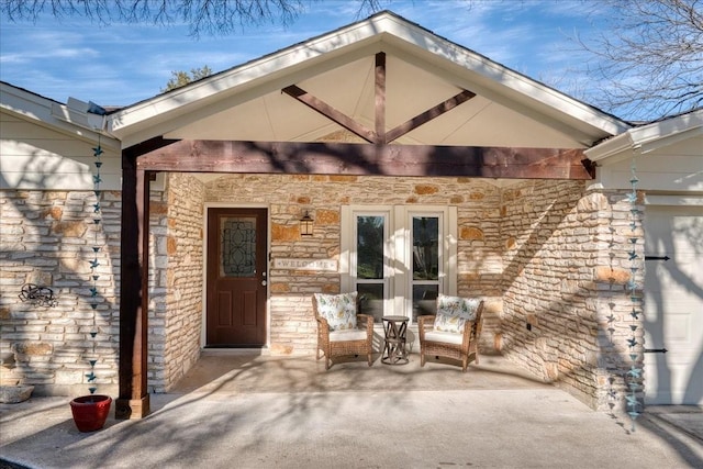 entrance to property with a patio