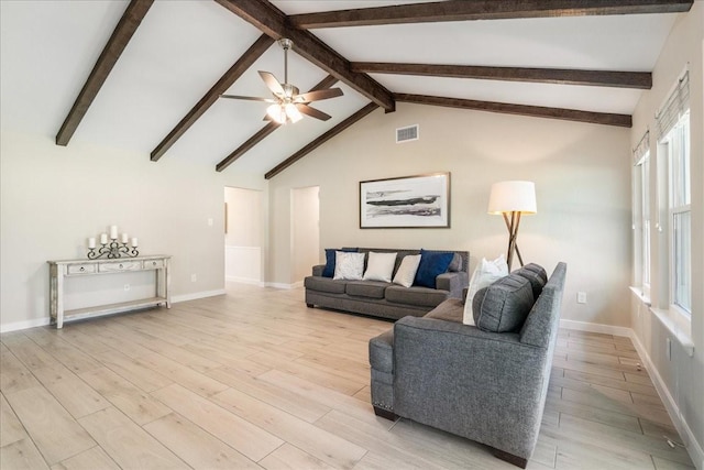 living room with light hardwood / wood-style floors, ceiling fan, a wealth of natural light, and vaulted ceiling with beams