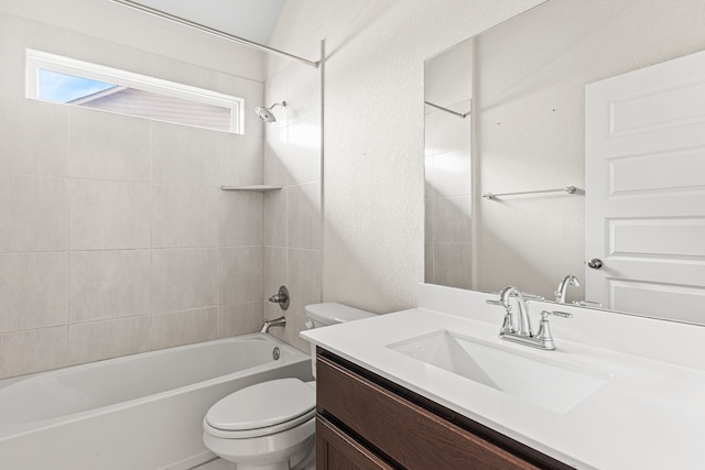 full bathroom featuring toilet, vanity, and tiled shower / bath