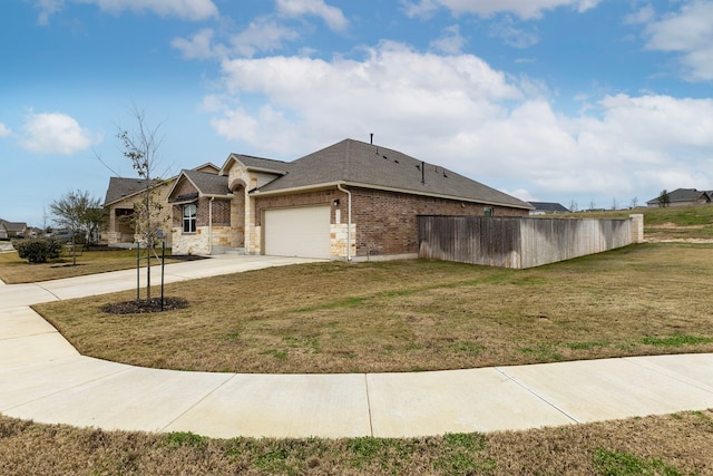 view of home's exterior featuring a lawn and a garage