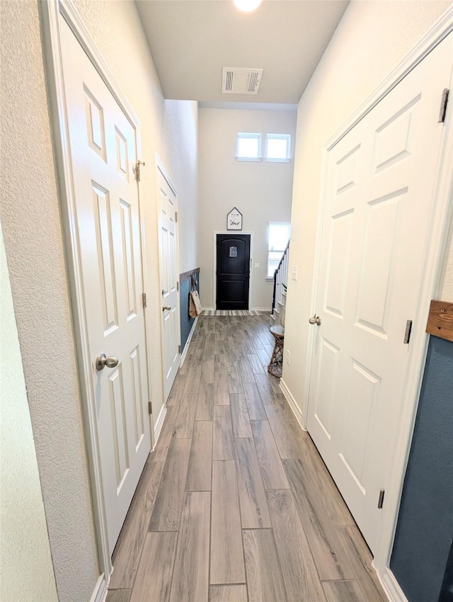 hall featuring light wood-type flooring