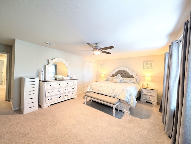 bedroom featuring ceiling fan and light colored carpet