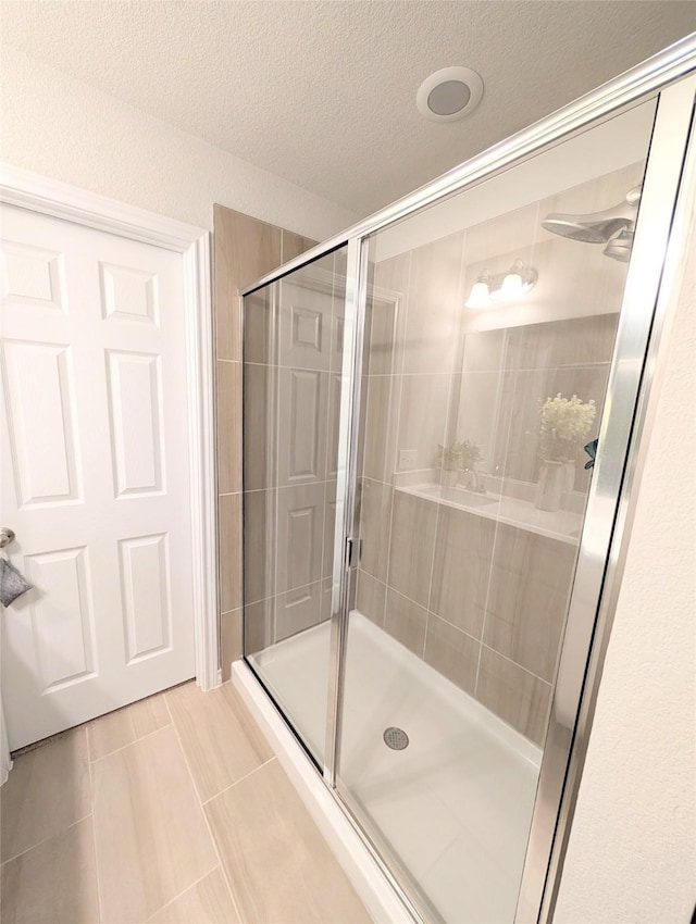 bathroom featuring an enclosed shower