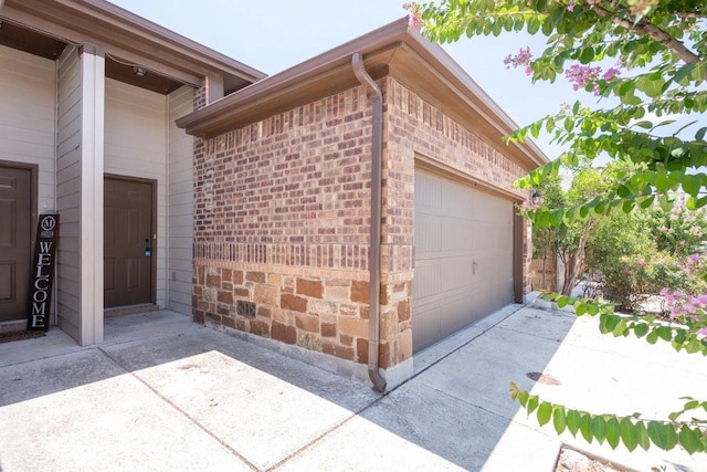 view of side of home featuring a garage