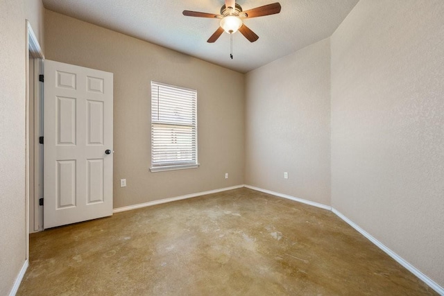 spare room with ceiling fan