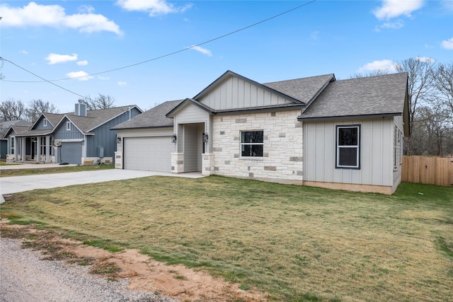 view of front of home with a front lawn and a garage