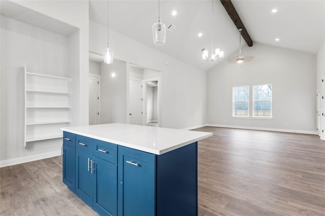 kitchen with a chandelier, a center island, hanging light fixtures, hardwood / wood-style floors, and beamed ceiling