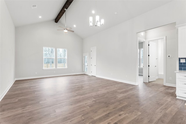 unfurnished living room with ceiling fan with notable chandelier, wood-type flooring, high vaulted ceiling, and beam ceiling