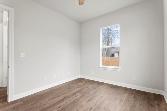 spare room with hardwood / wood-style flooring and ceiling fan