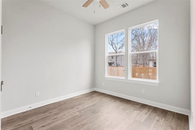 spare room featuring ceiling fan and hardwood / wood-style floors