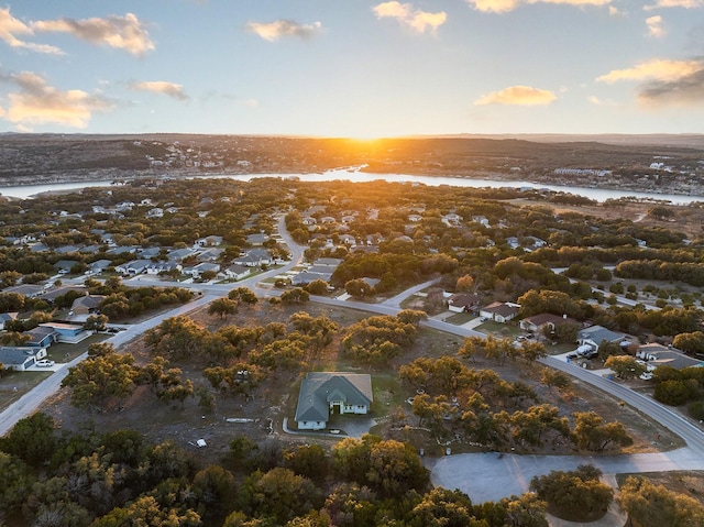 aerial view at dusk with a water view