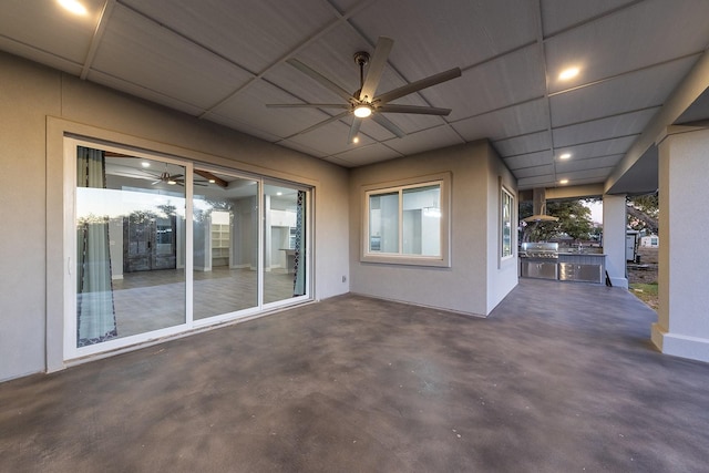 view of patio featuring exterior kitchen and ceiling fan