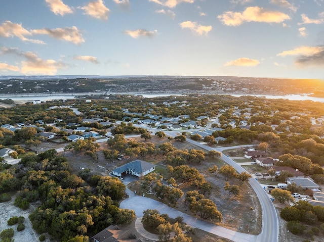 aerial view at dusk with a water view