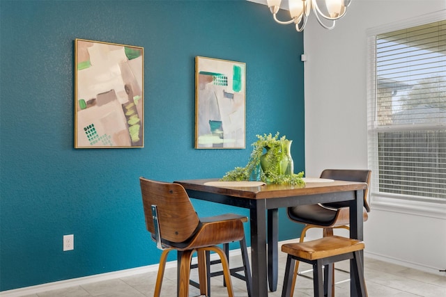 dining area with an inviting chandelier and light tile patterned floors