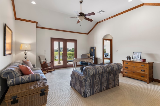 living room featuring lofted ceiling, ceiling fan, french doors, and light carpet