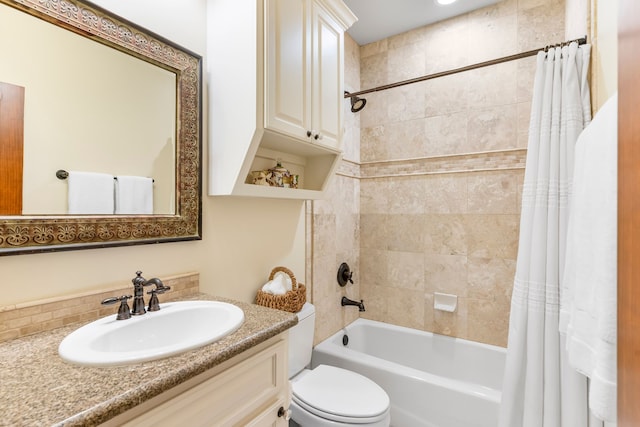 full bathroom featuring backsplash, toilet, vanity, and shower / bath combo