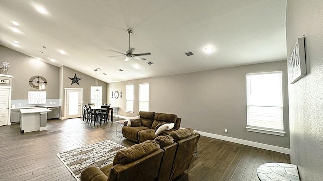 living room with sink, dark wood-type flooring, high vaulted ceiling, and ceiling fan