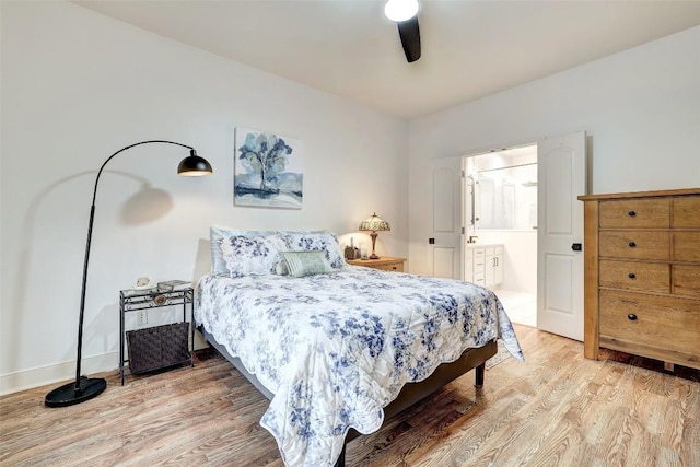 2210 Onion Creek Pkwy Unit 603, Austin, TX 78747 - bedroom with light wood-style flooring, ensuite bath, and ceiling fan