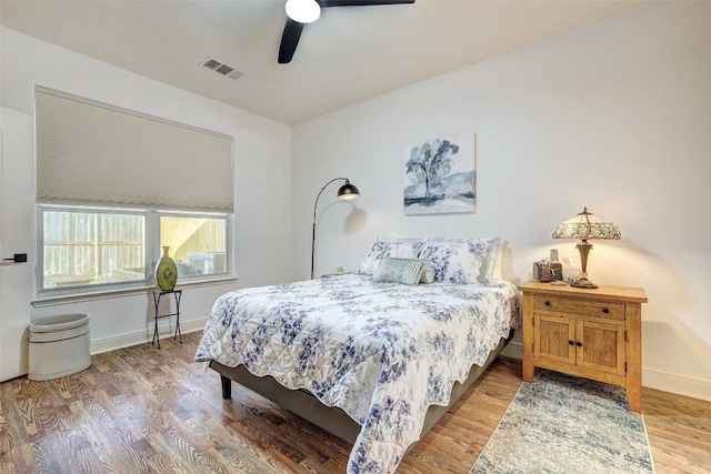 2210 Onion Creek Pkwy Unit 603, Austin, TX 78747 - bedroom featuring light wood-type flooring, baseboards, and a ceiling fan