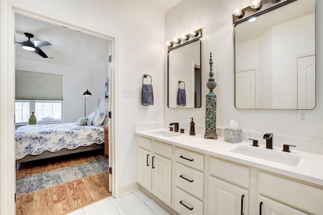 2210 Onion Creek Pkwy Unit 603, Austin, TX 78747 - bathroom featuring connected bathroom, double vanity, ceiling fan, and tile patterned floors