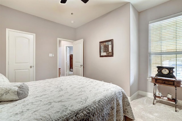 2210 Onion Creek Pkwy Unit 603, Austin, TX 78747 - bedroom with carpet flooring, baseboards, and a ceiling fan
