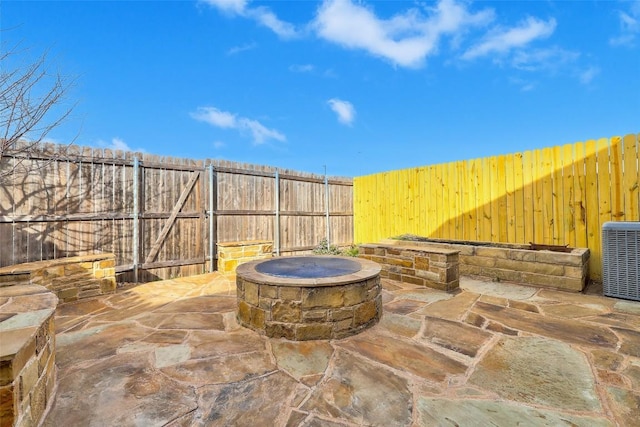 2210 Onion Creek Pkwy Unit 603, Austin, TX 78747 - fenced backyard featuring a fire pit, a patio area, and cooling unit