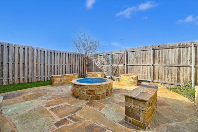 2210 Onion Creek Pkwy Unit 603, Austin, TX 78747 - fenced backyard featuring an outdoor fire pit and a patio area