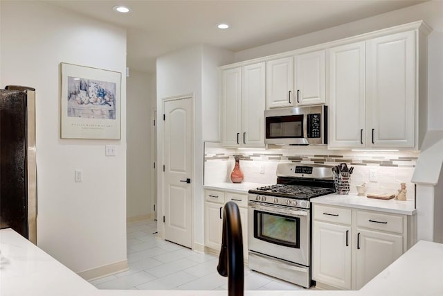 2210 Onion Creek Pkwy Unit 603, Austin, TX 78747 - kitchen featuring stainless steel appliances, light countertops, white cabinetry, backsplash, and recessed lighting