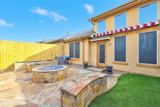 2210 Onion Creek Pkwy Unit 603, Austin, TX 78747 - view of patio featuring a fire pit and cooling unit