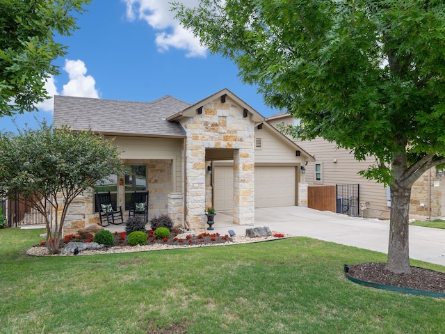 view of front of property with a garage and a front lawn