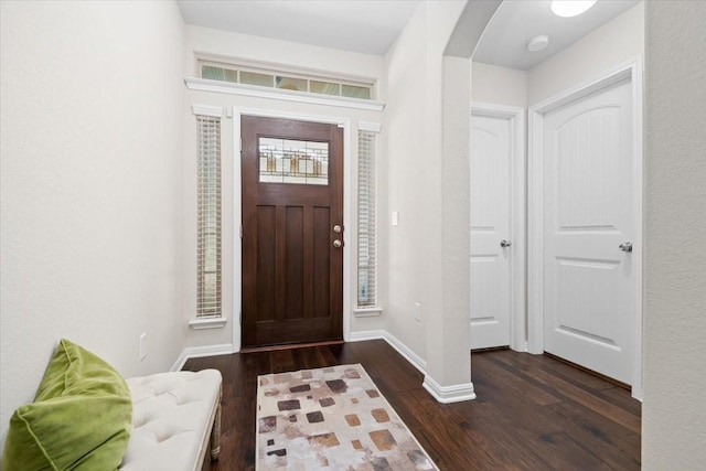 entrance foyer featuring dark hardwood / wood-style flooring