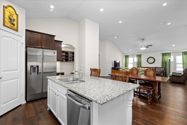 kitchen with appliances with stainless steel finishes, ceiling fan, lofted ceiling, and sink